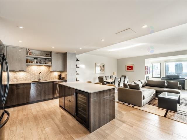 renovation condo montreal (1) Modern condo living room with open-concept layout and hardwood flooring